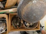 a box full of pots and pans sitting on the floor