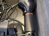 a black computer mouse and a black keyboard on a desk