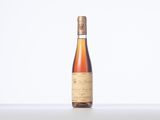 the bottle of wine is sitting on the table with a white background