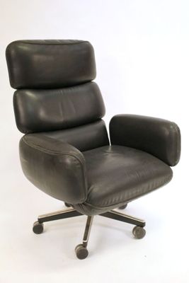 an image of a black leather office chair on casteors on a white background