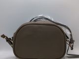 brown leather cross body bag with fur lining and shoulder strap