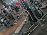 a gym with a lot of machines in it