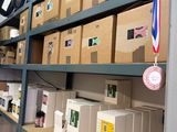 many boxes on the shelves in the room