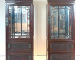two wooden cabinets with glass doors on each of them