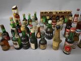 many different types of alcohol bottles on the table