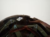 a close up of a helmet with a tag on it