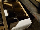 bottles of wine are in a wooden box in a cave