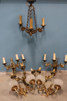 a chandelier that has five lights on each of it