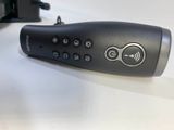 a remote control sitting on a table next to a keyboard