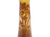 a vase that has a picture of a tree on it