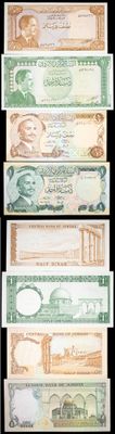 four different bills of different colors and shapes on a black background