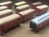 several toy trains are lined up on the floor next to each other