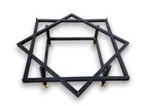 a close up of a metal object on a white surface