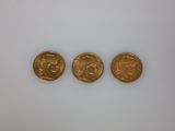 three gold coins, one of which is a sovereign and one of which is a sovereign