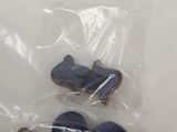 a bag of blue rocks and a pair of shoes in it