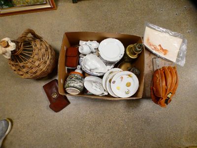 a box full of assorted items sitting on the floor