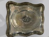 a silver tray with a picture of a horse on it