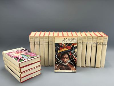 several books are stacked on top of each other on a table