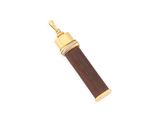 a close up of a wooden and gold pendant on a white background