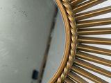a mirror that is hanging on the wall