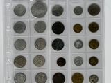 a lot of coins in a plastic case on the table