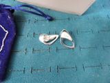 a pair of scissors and a bag on a table