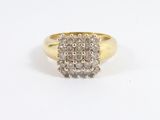 an image of a diamond cluster ring on a white background