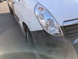 a white van that is parked in a parking lot