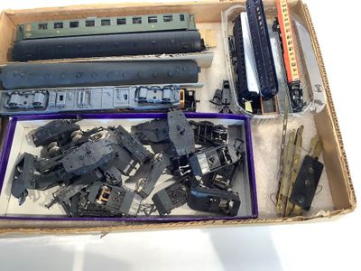 a box full of different types of toy trains in it