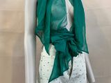 an image of a mannequin wearing a green scarf