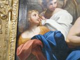 un tableau représentant un ange et une femme tenant un enfant dans ses bras