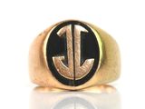 an image of a gold and black ring with the letter j on it