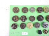 a lot of coins that are on a green surface