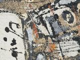 a close up of a painting on a wall
