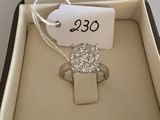 an image of a diamond ring in a box with a price tag