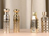 three different types of perfume bottles sitting on a table