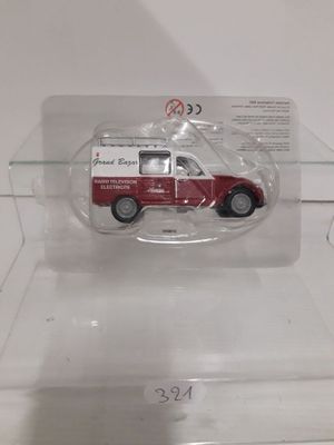 a small red truck in a clear display case