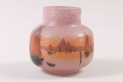a pink vase with a picture of boats on it