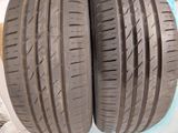 two tires are shown on a white surface with a blue background