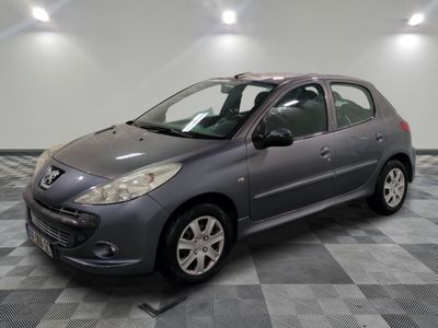 a picture of a grey car parked in a garage