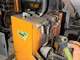 a machine that is sitting on a pallet in a garage