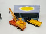 two toy trucks that are sitting next to each other