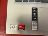 a close up of a laptop with a qr code on the keyboard