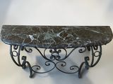 wrought iron and marble console table with a marble top