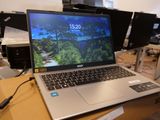 a laptop computer sitting on top of a table