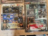 a lot of action figures in the package on the table
