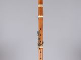 a close up of a musical instrument on a stand on a gray background