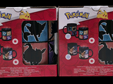 two boxes of pokemon mugs on display in a store