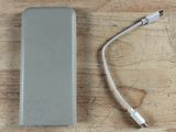 a power bank and a charger sitting on a table