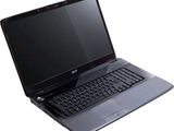 un ordinateur portable noir avec un clavier noir sur fond blanc